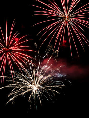 Festive celebration firework lights in the dark night skyの写真素材
