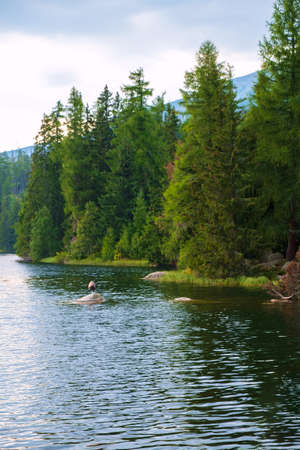 Strbske pleso mountain lake in autumn, in National Park High Tatra, Slovakiaの写真素材