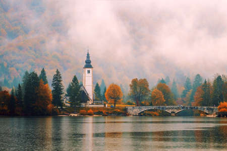 Foggy morning in autumn at Lake Bohinj In National Park Triglav, Sloveniaの写真素材