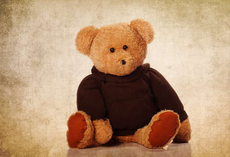 Cute teddy bear on the grunge backgroundの写真素材