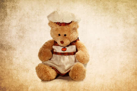 Cute teddy bear on the grunge backgroundの写真素材