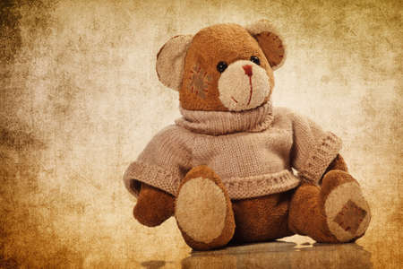 Cute teddy bear on the grunge backgroundの写真素材