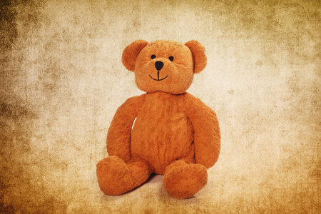 Cute teddy bear on the grunge backgroundの写真素材