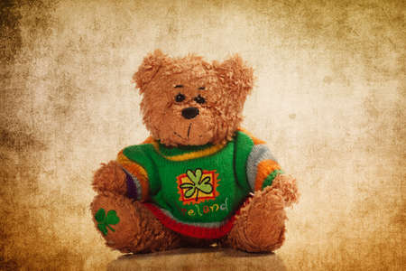 Cute teddy bear on the grunge backgroundの写真素材
