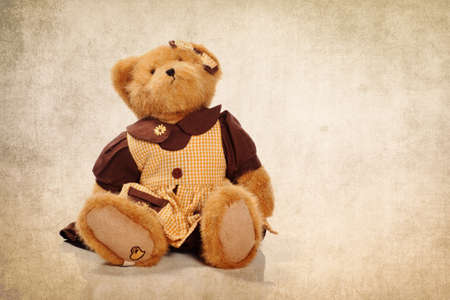 Cute teddy bear on the grunge backgroundの写真素材