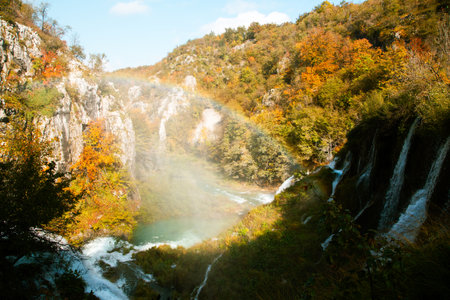 Scenic Autumn Waterfall in Serene Forest Setting of Plitvice Lakes National Parkの写真素材