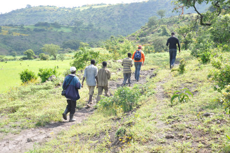 Men walking in the rehabilitated Ethiopian highlandsのeditorial素材