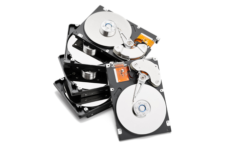 Stack of open harddrives. Isolated on the white backgroundの写真素材