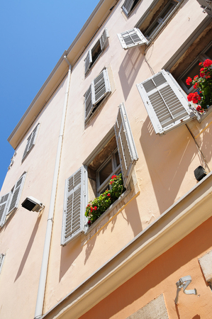 Vivid vintage wall with windows of old town. Rovin. Croatia.の写真素材