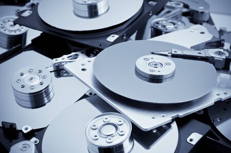 Open hard drives in bulk. Blue toned imageの写真素材