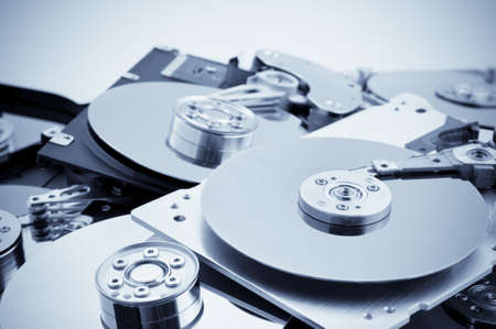 Open hard drives in bulk. Blue toned imageの写真素材