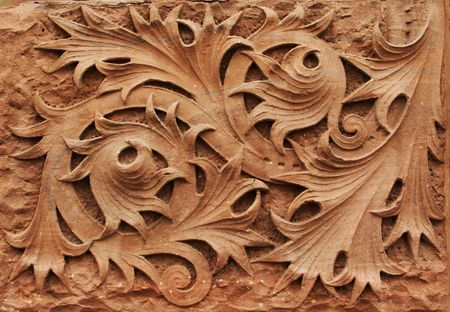 Close-up image of ornate stone carving on building facade.の写真素材