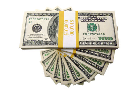 Spiraling Stacks of Hundred Dollar Bills on a white background.