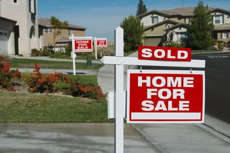 Home For Sale Signs & One Sold in Front of New Homesの写真素材