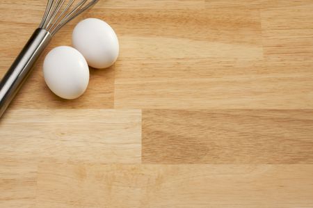 Mixer and Eggs on a wooden background.の写真素材