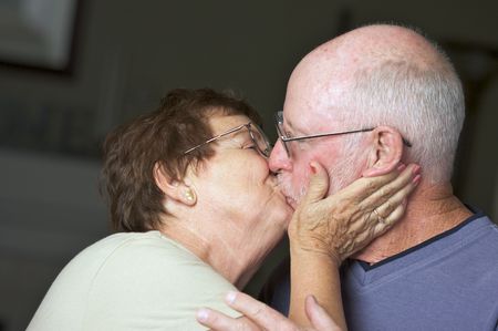 Happy Senior Adult Couple Kissingの写真素材
