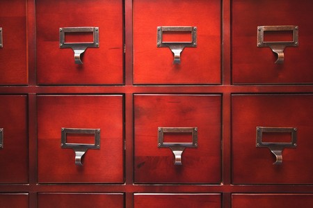 Lustrous Wooden Card File Cabinet in Dramatic LIghtの写真素材