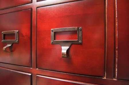 Lustrous Wooden Card File Cabinet in Dramatic LIghtの写真素材