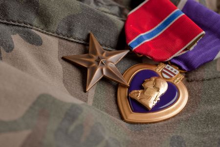 Bronze and Purple Heart Medals on Camouflage Materialの写真素材