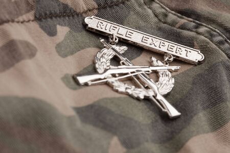 Rifle Expert War Medal on a Camouflage Material.の写真素材