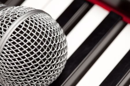 Microphone Laying on Electronic Keyboard with Narrow Depth of Field.の写真素材