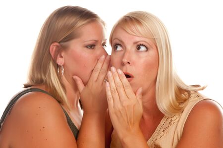 Two Blonde Woman Whispering Secrets Isolated on a White Background.の写真素材