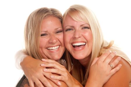 Two Beautiful Sisters Laughing Isolated on a White Background.の写真素材
