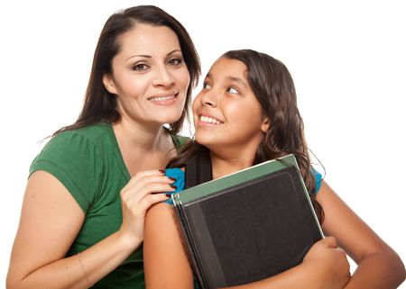 Proud Hispanic Mother and Daughter Ready for School Isolated on a White Background.の写真素材
