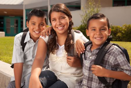 Cute Brothers and Sister Wearing Backpacks Ready for School.の写真素材