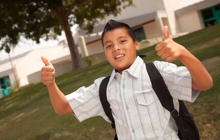 Happy Young Hispanic Boy with Backpack Ready for School.の写真素材