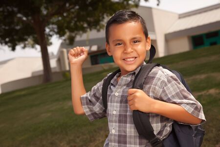Happy Young Hispanic Boy with Backpack Ready for School.の写真素材