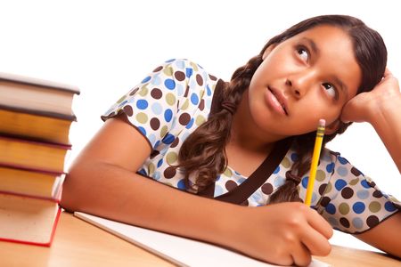 Pretty Hispanic Girl Studying Isolated on a White Background.の写真素材