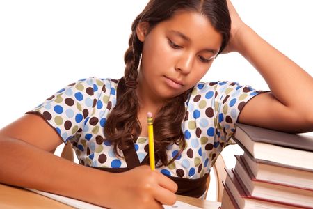 Pretty Hispanic Girl Studying Isolated on a White Background.の写真素材