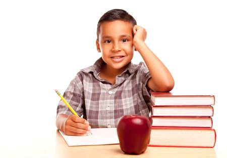 Adorable Hispanic Boy with Books, Apple, Pencil and Paper Isolated on a White Background.の写真素材