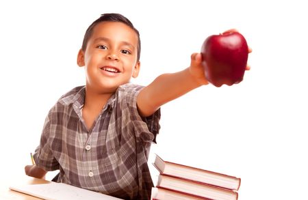 Adorable Hispanic Boy with Books, Apple, Pencil and Paper Isolated on a White Background.の写真素材