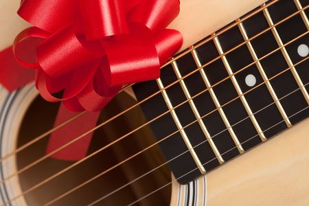 Guitar Strings with Red Ribbon - The Gift of Music.の写真素材