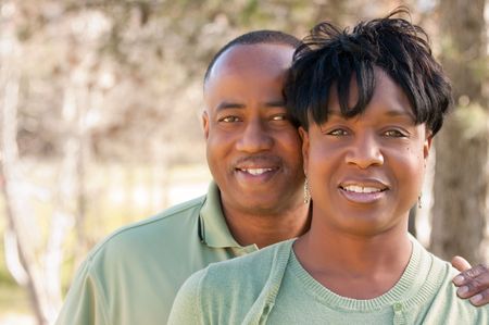 Attractive and Affectionate African American Couple posing in the park.の写真素材