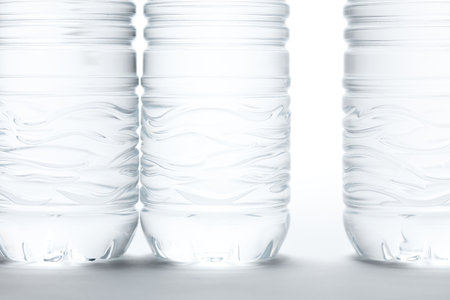 Water Bottles Abstract Image on a Gradated White Background.