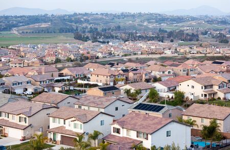 Contemporary Neighborhood Houses Roof Tops and Horizon View.の写真素材