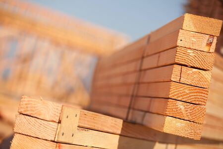 Stack of Building Lumber at Construction Site with Narrow Depth of Field.の写真素材