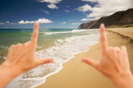 Hands Framing Polihale Beach on Kauai, Hawaiiの写真素材
