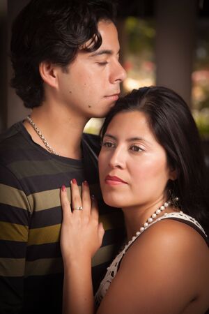 Attractive Hispanic Couple Portrait Enjoying Each Other Outdoors.の写真素材