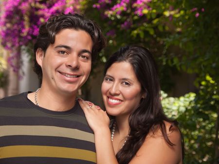 Attractive Hispanic Couple Portrait Enjoying Each Other Outdoors.の写真素材