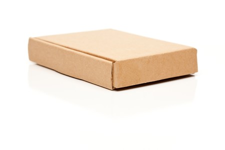Closed Thin Cardboard Box Isolated on a White Background.の写真素材