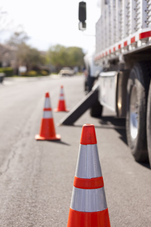 Orange Hazard Safety Cones and Work Truck on the Street.の写真素材