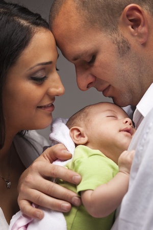 Happy Young Attractive Mixed Race Family with Newborn Baby.の写真素材