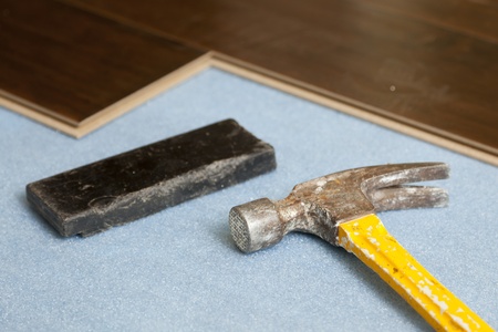 Hammer and Block with New Laminate Flooring Abstract.の写真素材