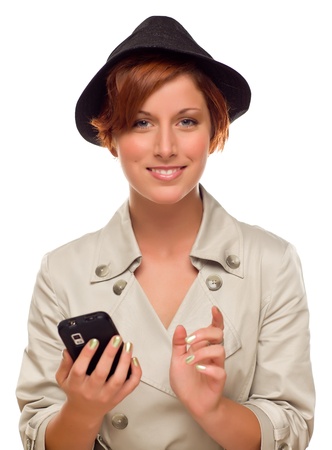Smiling Young Woman Holding Smart Cell Phone Isolated on a White Background.の写真素材