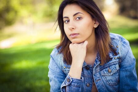 Beautiful Mixed Race Young Woman Portrait Outside In The Grass.の写真素材