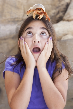 Young Pretty Girl Playing with Toy Hermit Crab.の写真素材